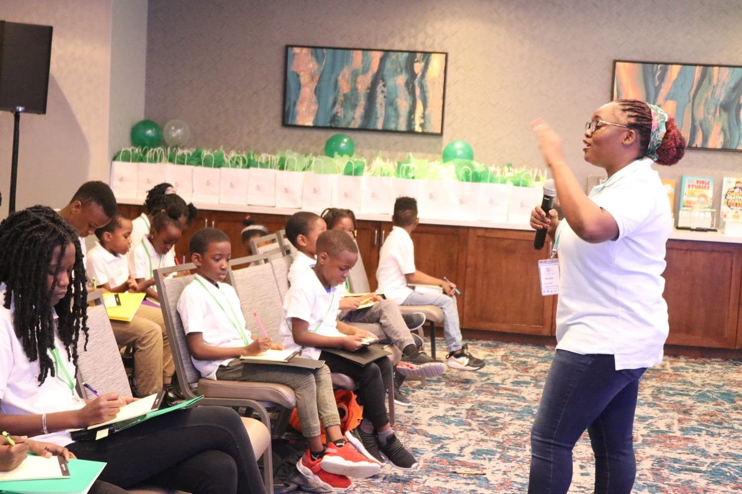 A mentor teaching young people during a Bible summit and youth development session