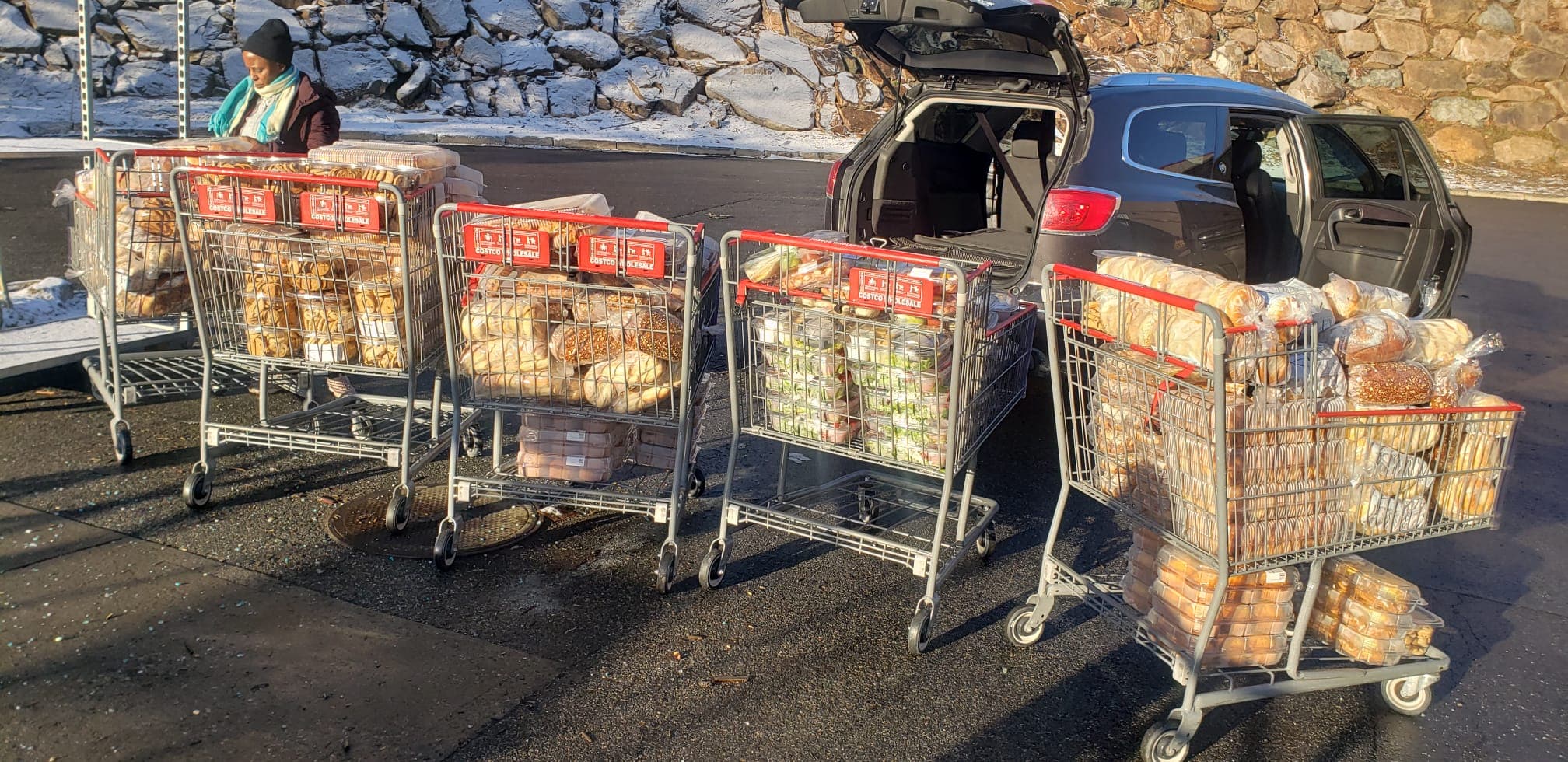 Carts filled with donated bread and prepared food for HESM outreach